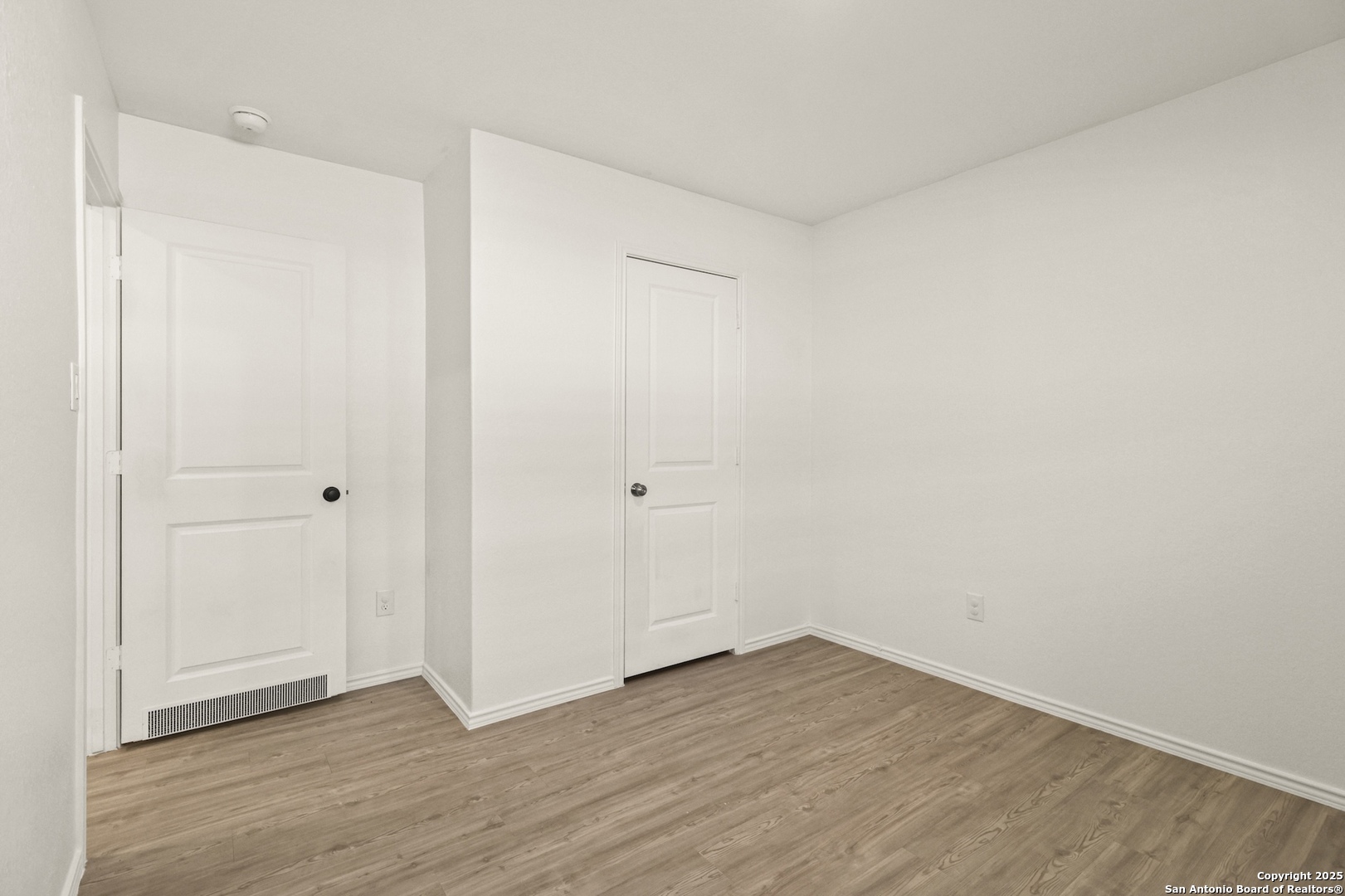 6430 Level Flight Converse, TX 78109 - Photo 14 of 19 a view of an empty room with wooden floor