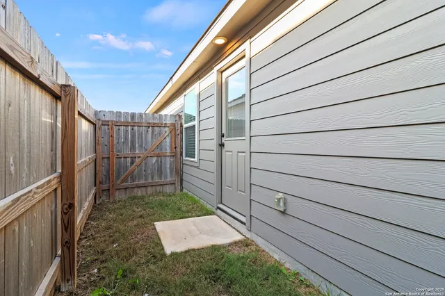 a view of a back yard of the house