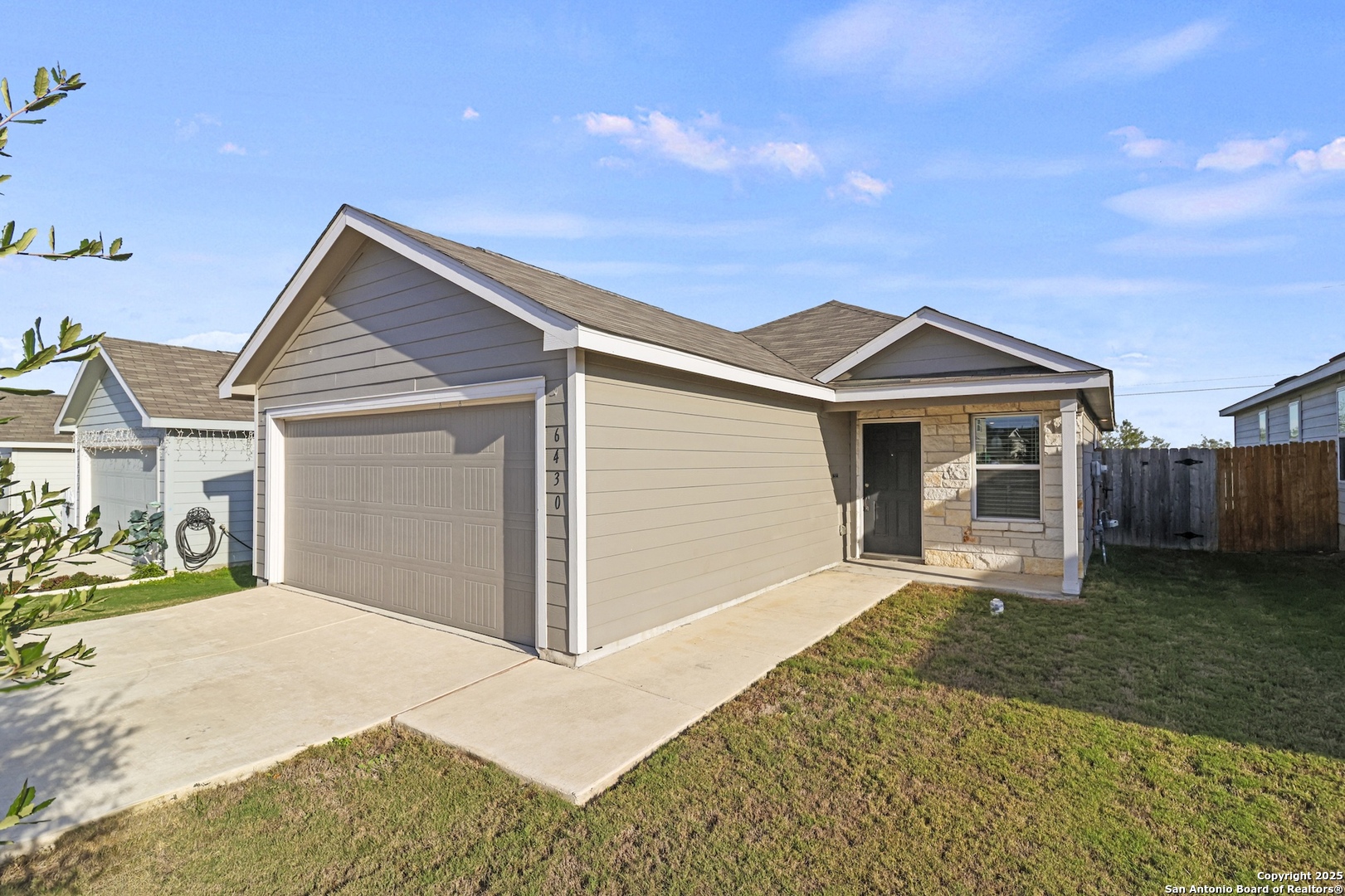 6430 Level Flight Converse, TX 78109 - Photo 2 of 19 a front view of a house with a yard