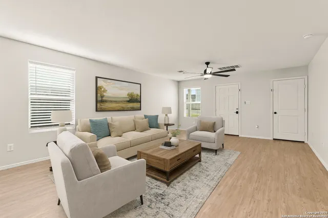 a living room with furniture and a large window