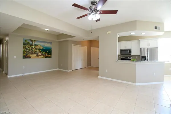 a view of a kitchen with a dishwasher and a refrigerator