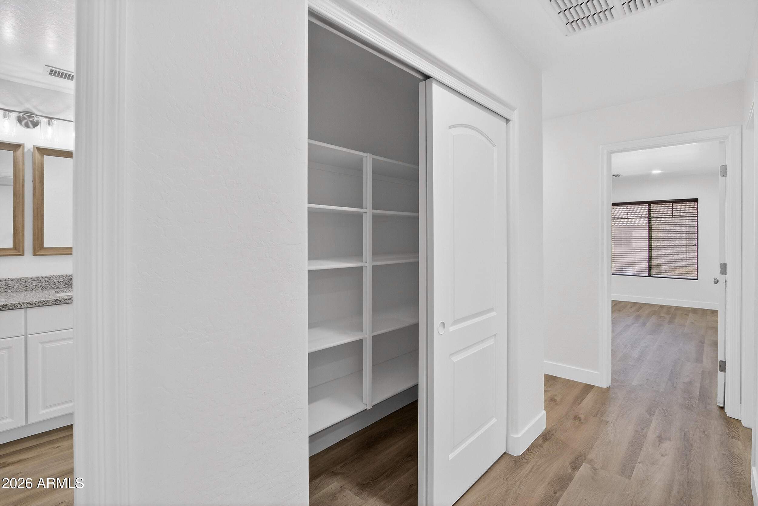 43620 West Cowpath Road Maricopa, AZ 85138 - Photo 51 of 60 a view of walk in closet with empty racks