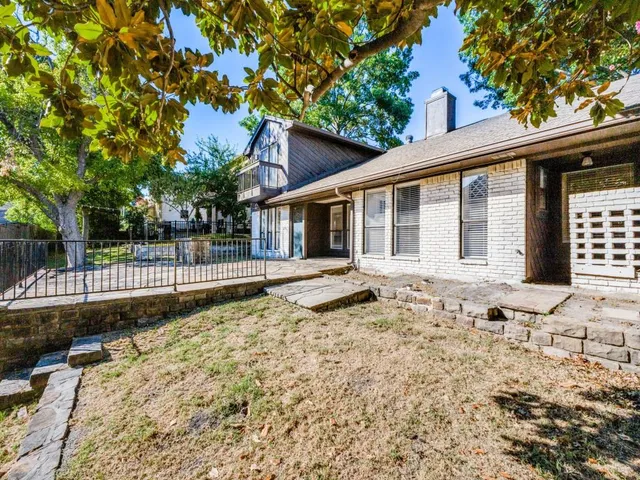 a house with trees in front of it