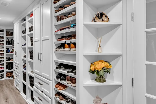 a view of a living room and shelves