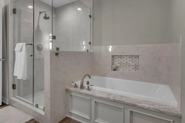 a bathroom with a sink a mirror and shower