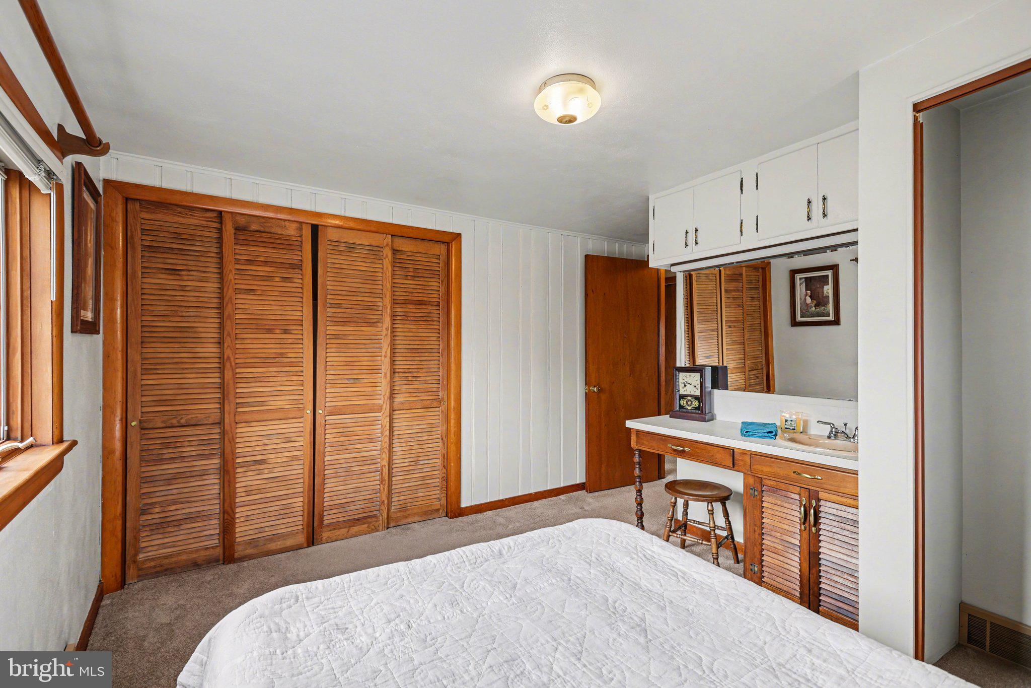 2708 Mill Road Mechanicsburg, PA 17055 - Photo 12 of 27 Cozy bedroom with warm wood accents.