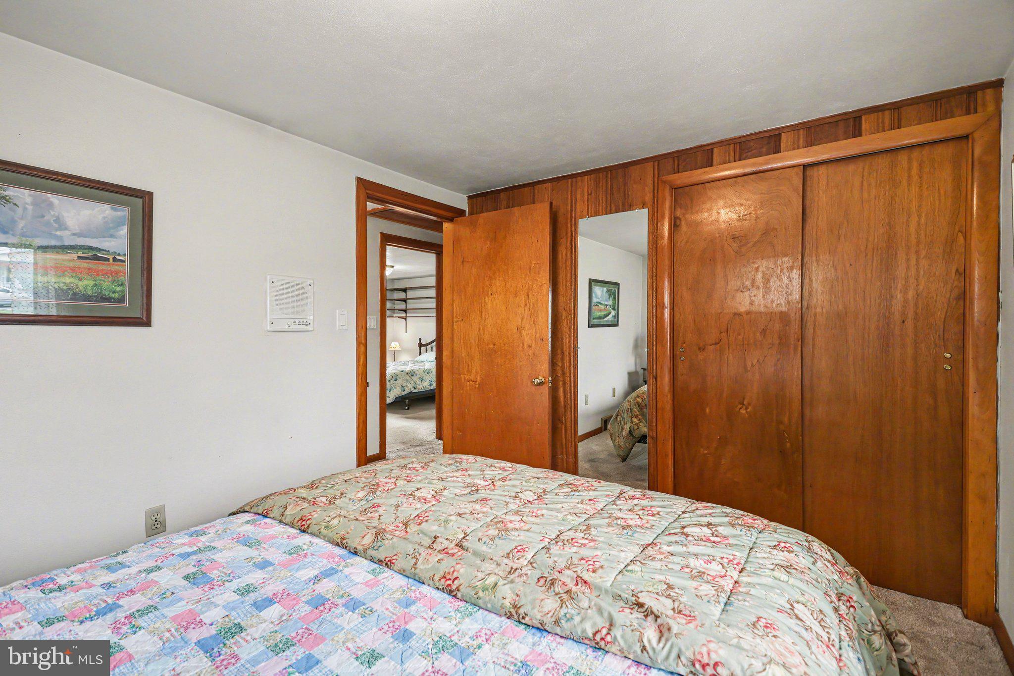 2708 Mill Road Mechanicsburg, PA 17055 - Photo 15 of 27 Cozy bedroom with warm wood accents.
