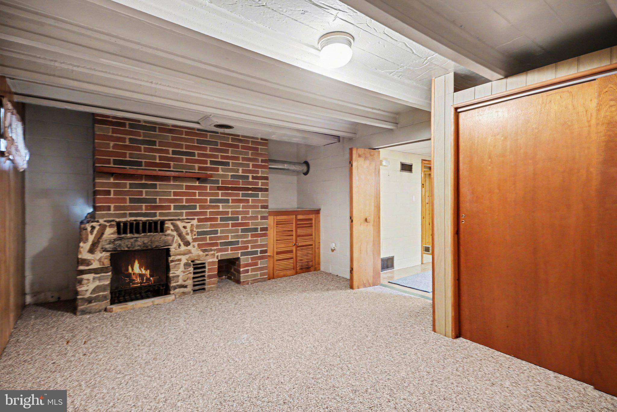 2708 Mill Road Mechanicsburg, PA 17055 - Photo 19 of 27 Cozy basement retreat with fireplace.