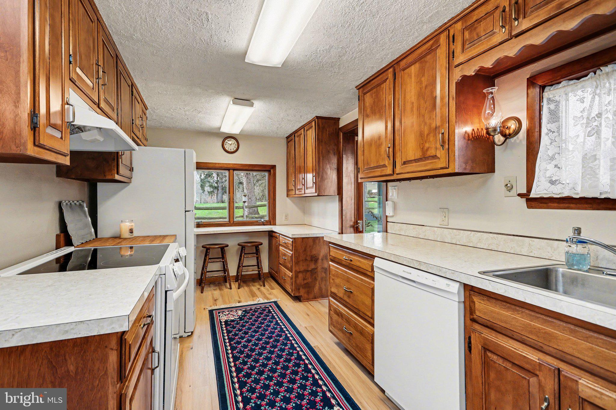 2708 Mill Road Mechanicsburg, PA 17055 - Photo 9 of 27 Warm wood tones in a cozy kitchen.
