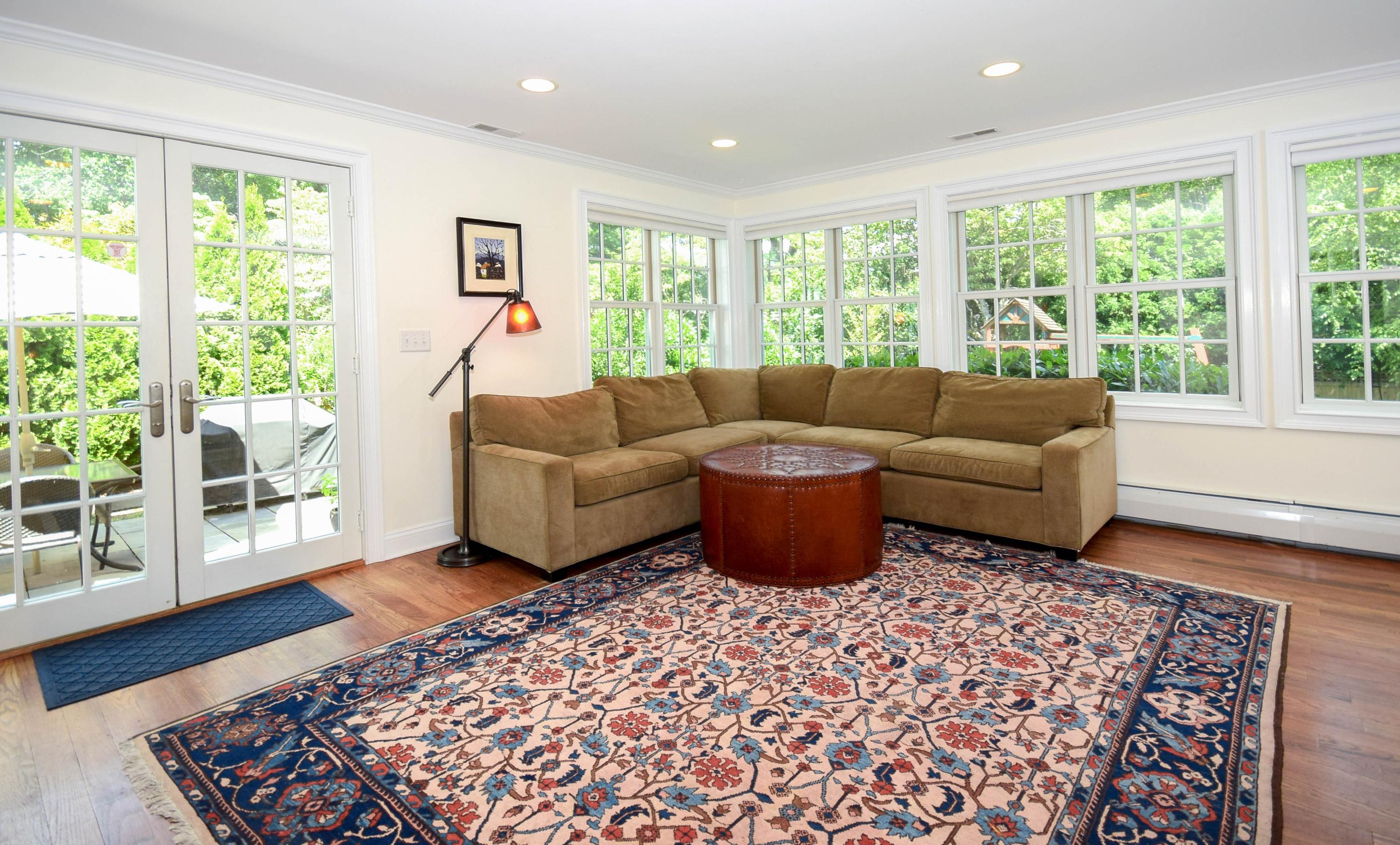 35 Ridgeley Street Darien, CT 06820 - Photo 11 of 25 a living room with furniture and a rug