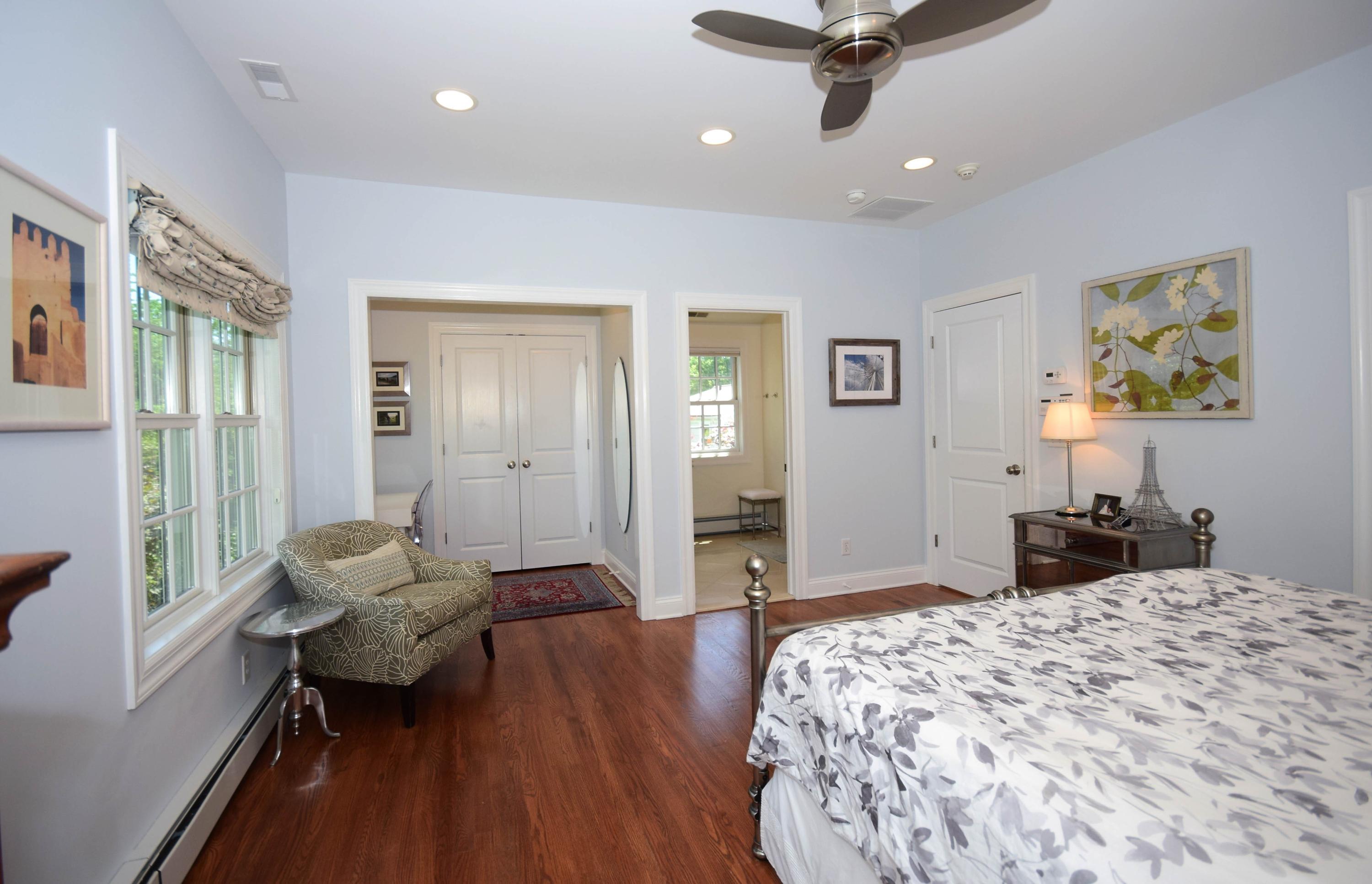 35 Ridgeley Street Darien, CT 06820 - Photo 13 of 25 a bedroom with a bed and wooden floor