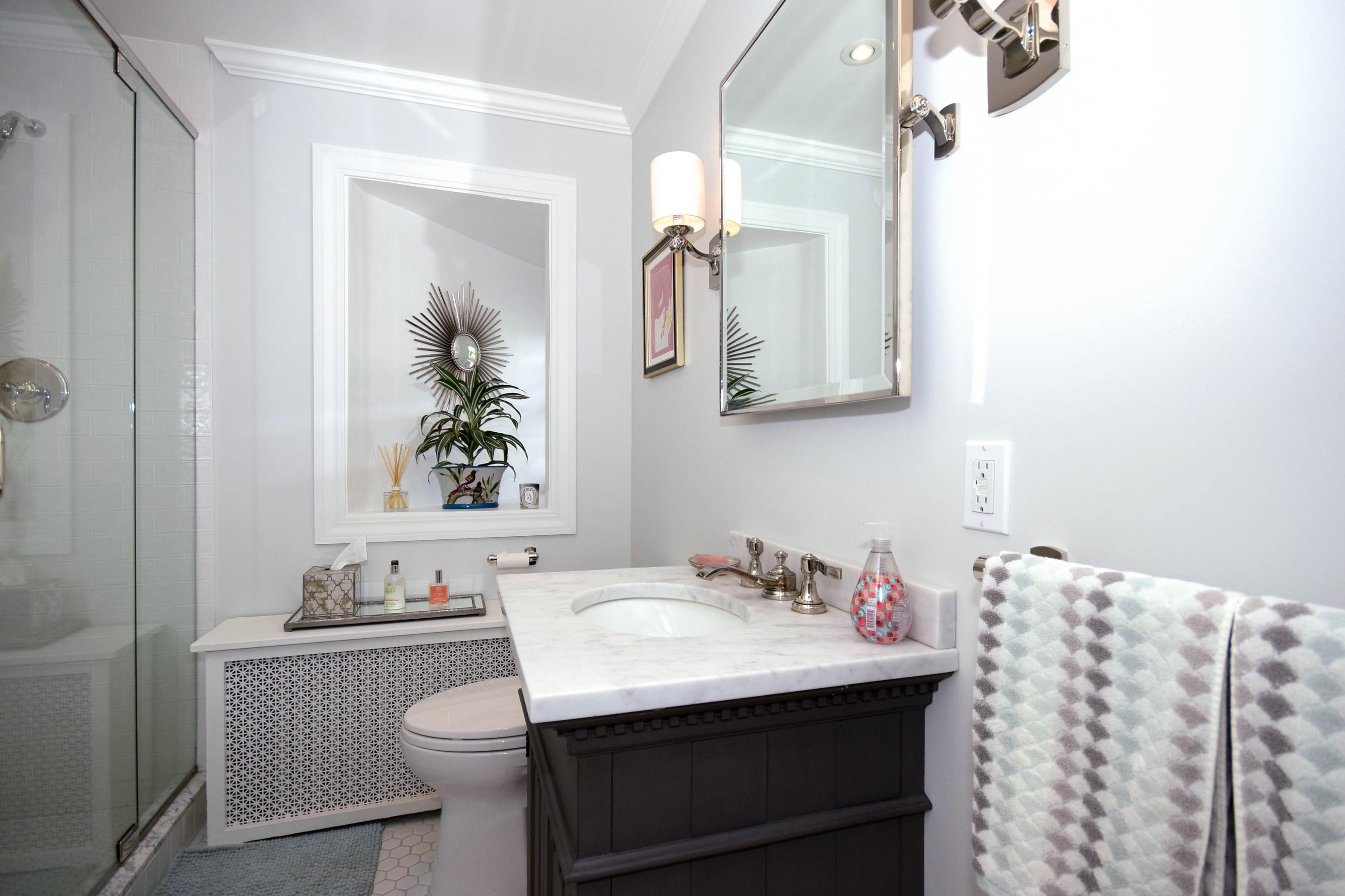35 Ridgeley Street Darien, CT 06820 - Photo 14 of 25 a bathroom with a sink and a mirror
