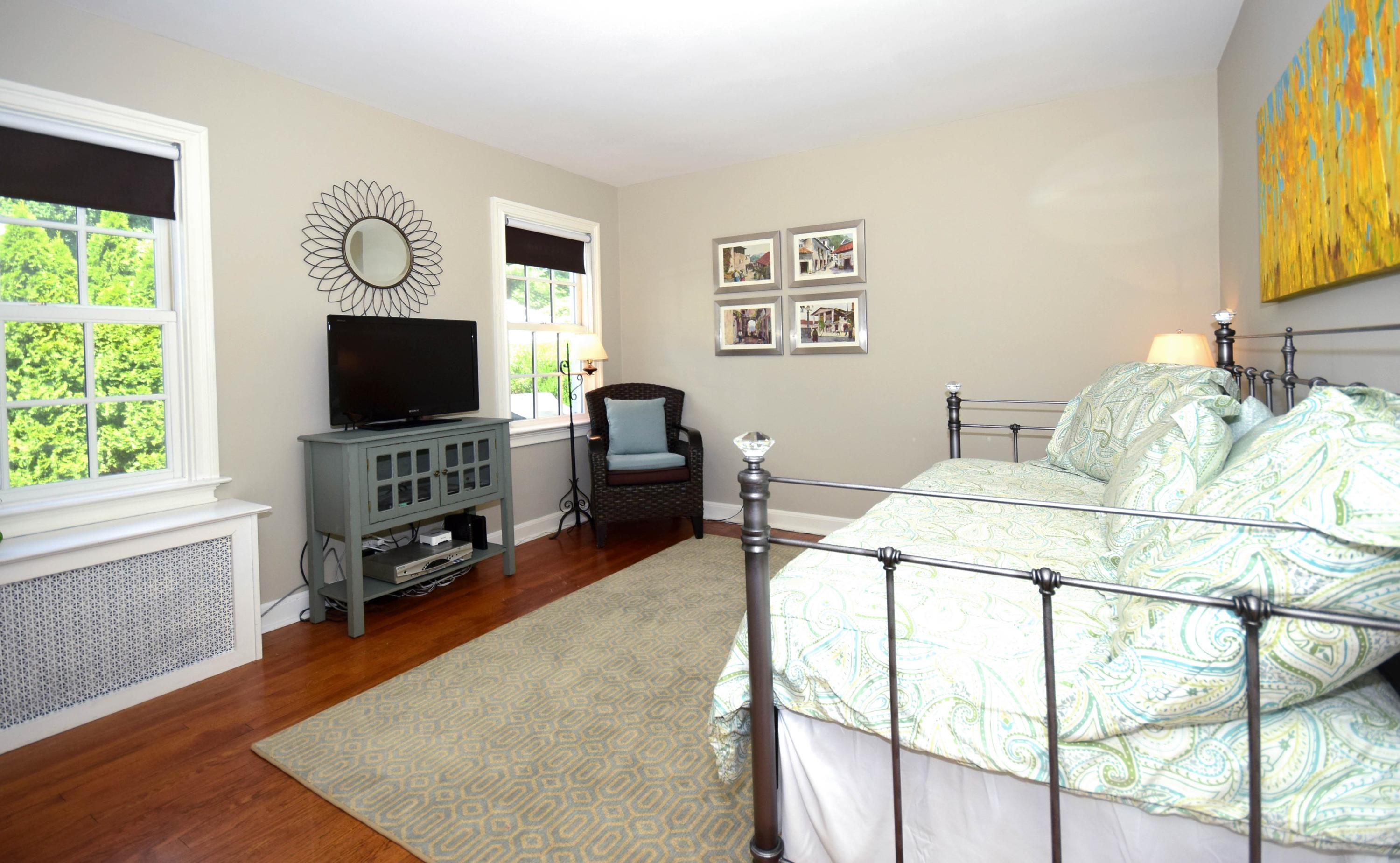 35 Ridgeley Street Darien, CT 06820 - Photo 17 of 25 a living room with furniture and a flat screen tv