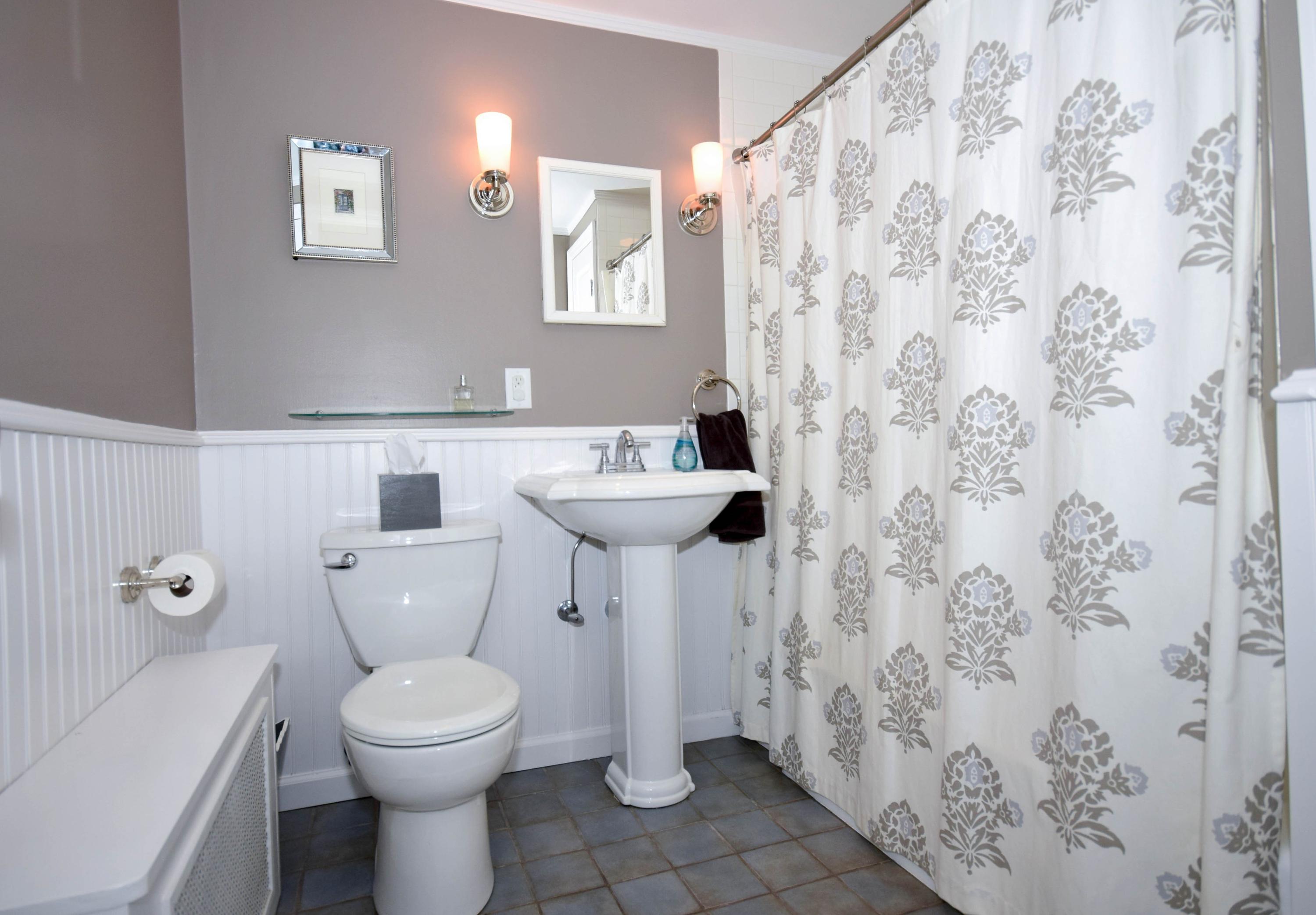 35 Ridgeley Street Darien, CT 06820 - Photo 18 of 25 a bathroom with a toilet sink and mirror