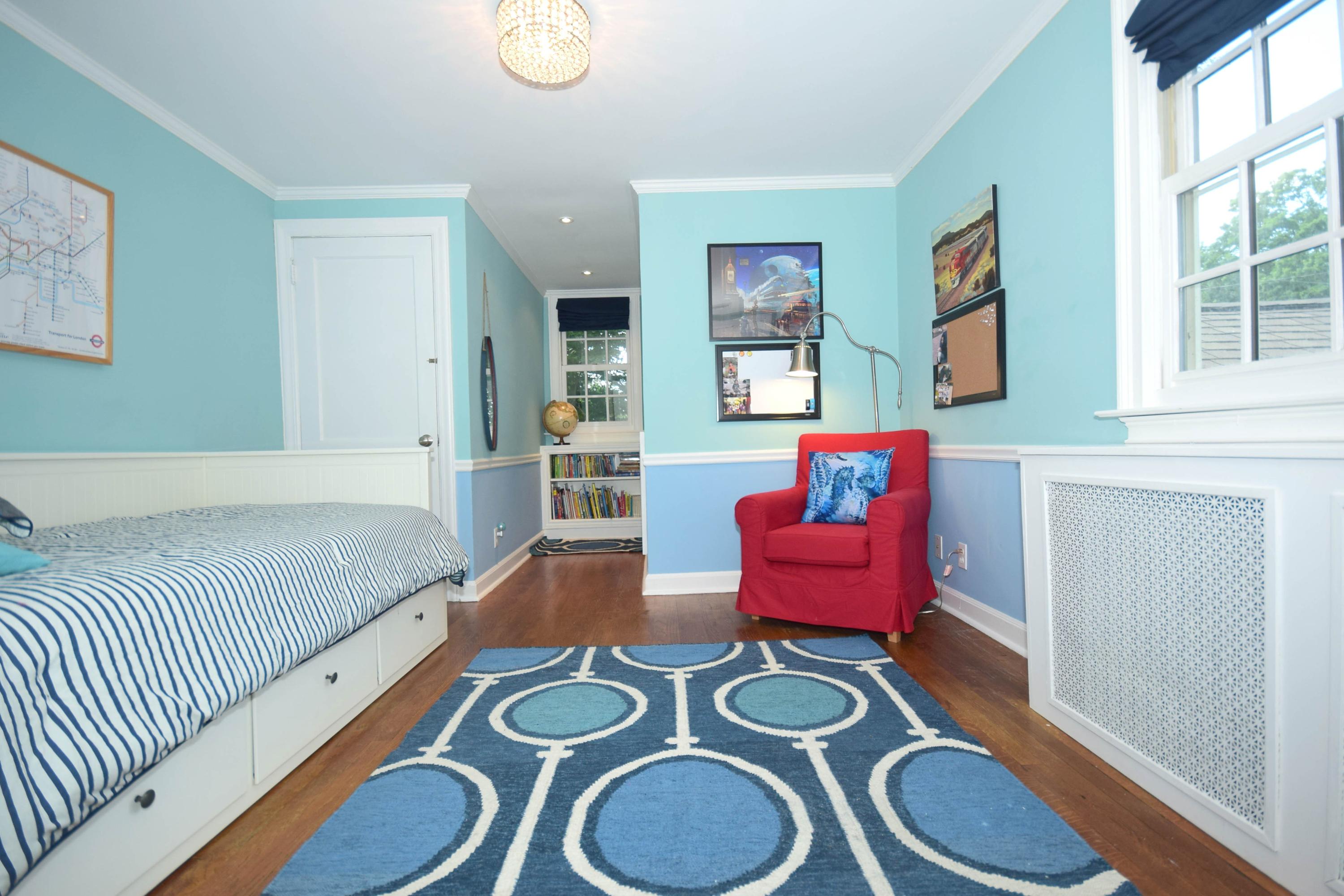 35 Ridgeley Street Darien, CT 06820 - Photo 20 of 25 a spacious bedroom with a bed and window