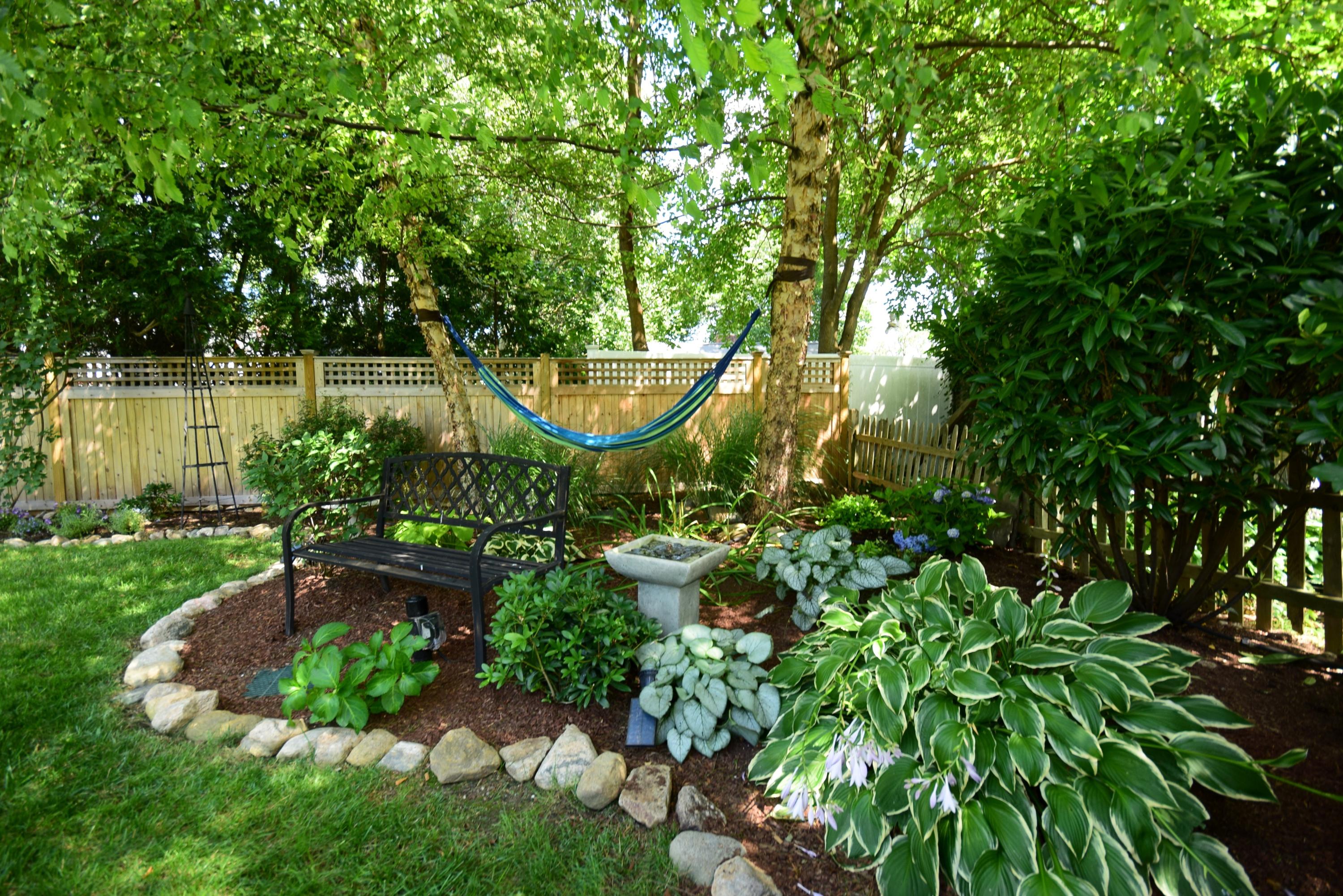 35 Ridgeley Street Darien, CT 06820 - Photo 23 of 25 a view of a garden with large trees