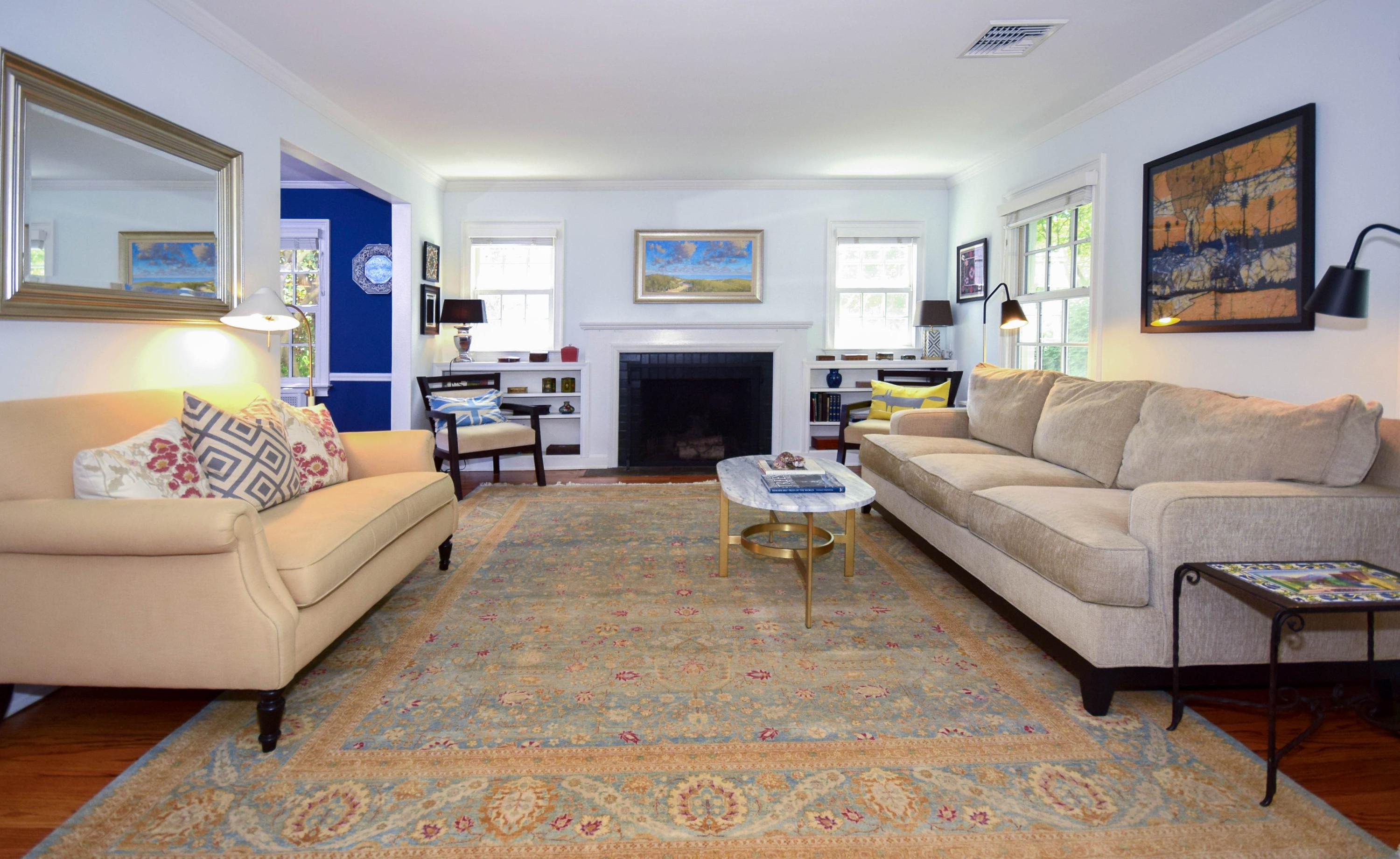 35 Ridgeley Street Darien, CT 06820 - Photo 3 of 25 a living room with furniture and a fireplace