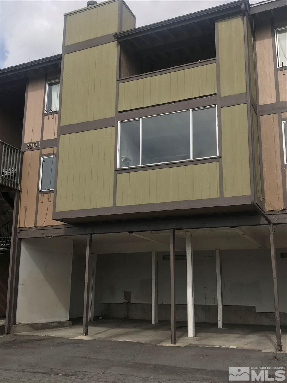 2101 Highview Court, Unit 7 Reno, NV 89512 - Photo 1 of 14 a front view of a house with a garage