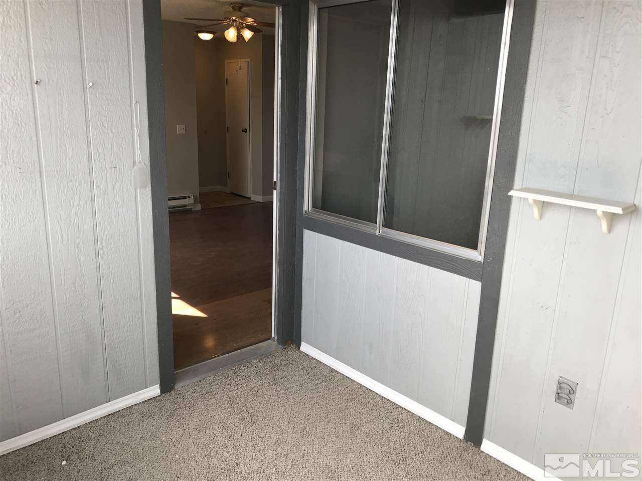 2101 Highview Court, Unit 7 Reno, NV 89512 - Photo 13 of 14 wooden floor and cabinet in an empty room