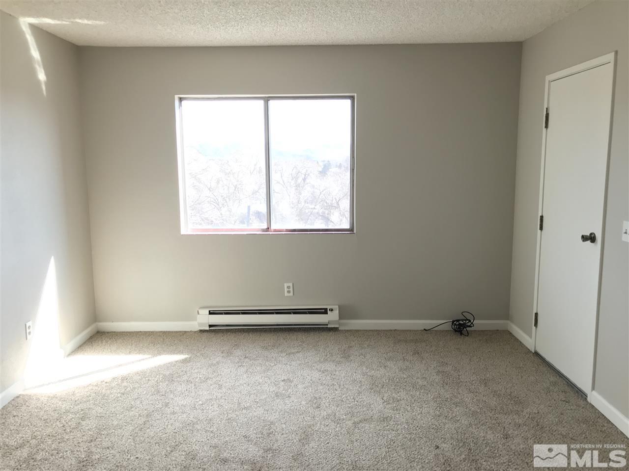 2101 Highview Court, Unit 7 Reno, NV 89512 - Photo 5 of 14 an empty room with a window