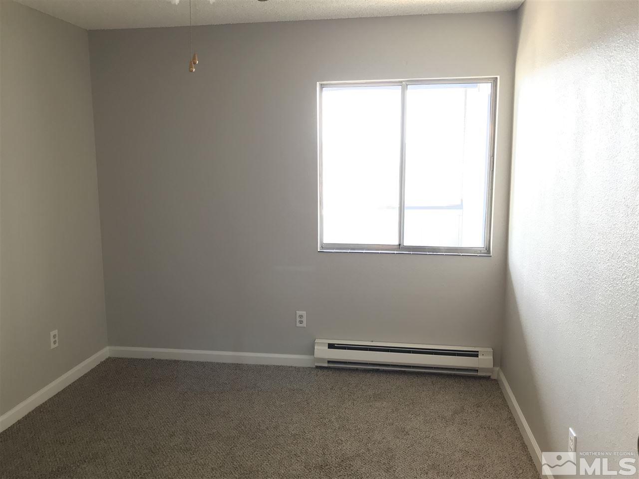 2101 Highview Court, Unit 7 Reno, NV 89512 - Photo 9 of 14 an empty room with a window