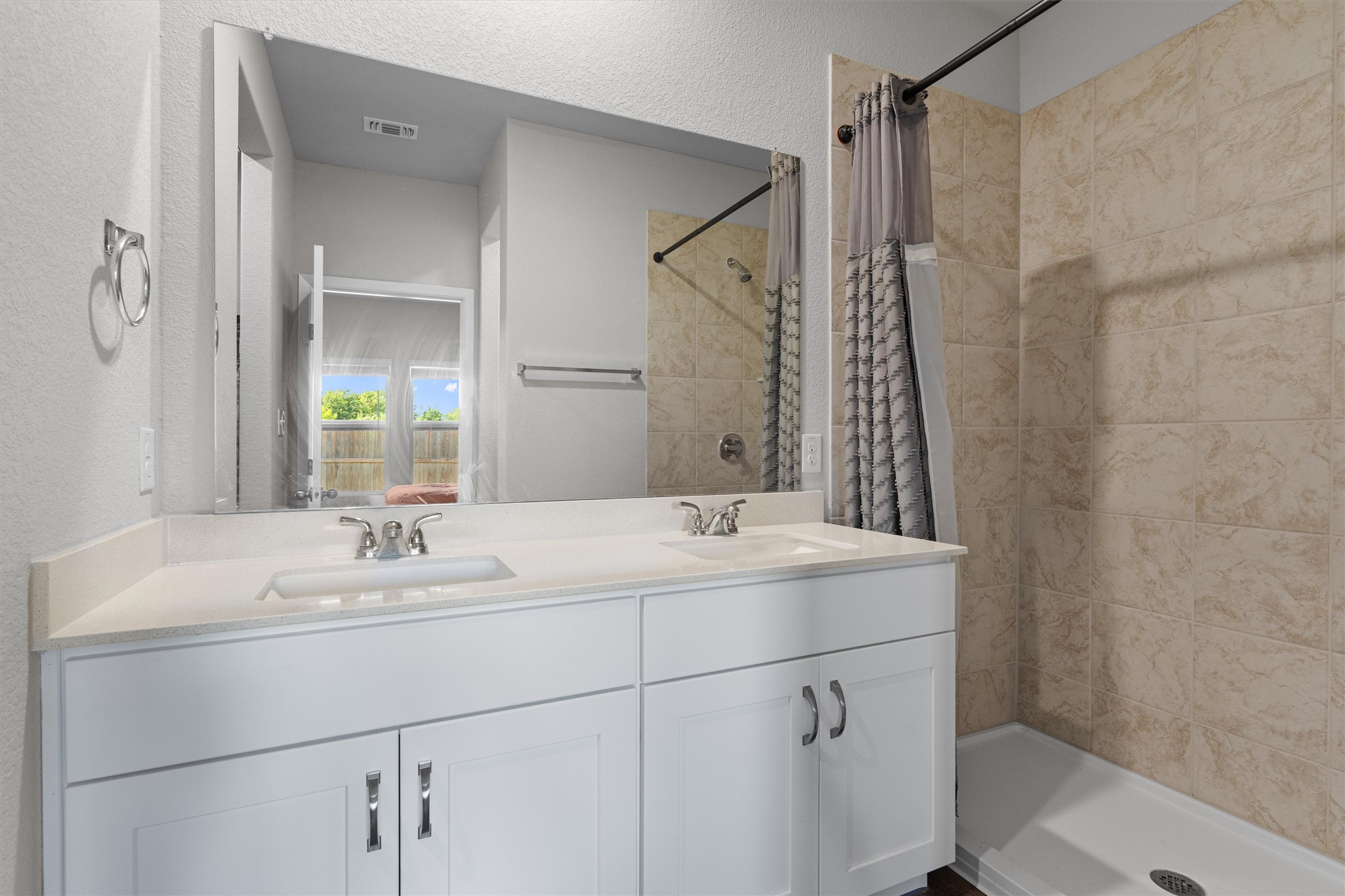 2606 Totley Road Manor, TX 78653 - Photo 13 of 28 a bathroom with a sink and a mirror