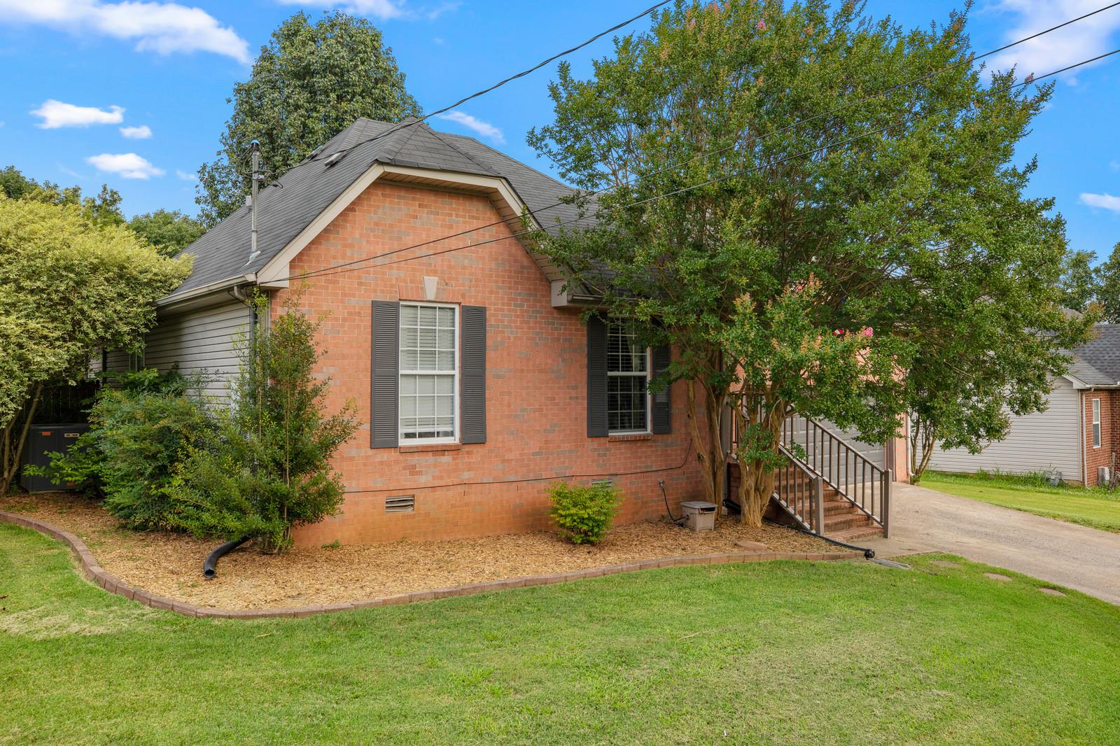3028 Stone Bridge Road Antioch, TN 37013 - Photo 1 of 30 a front view of a house with a yard