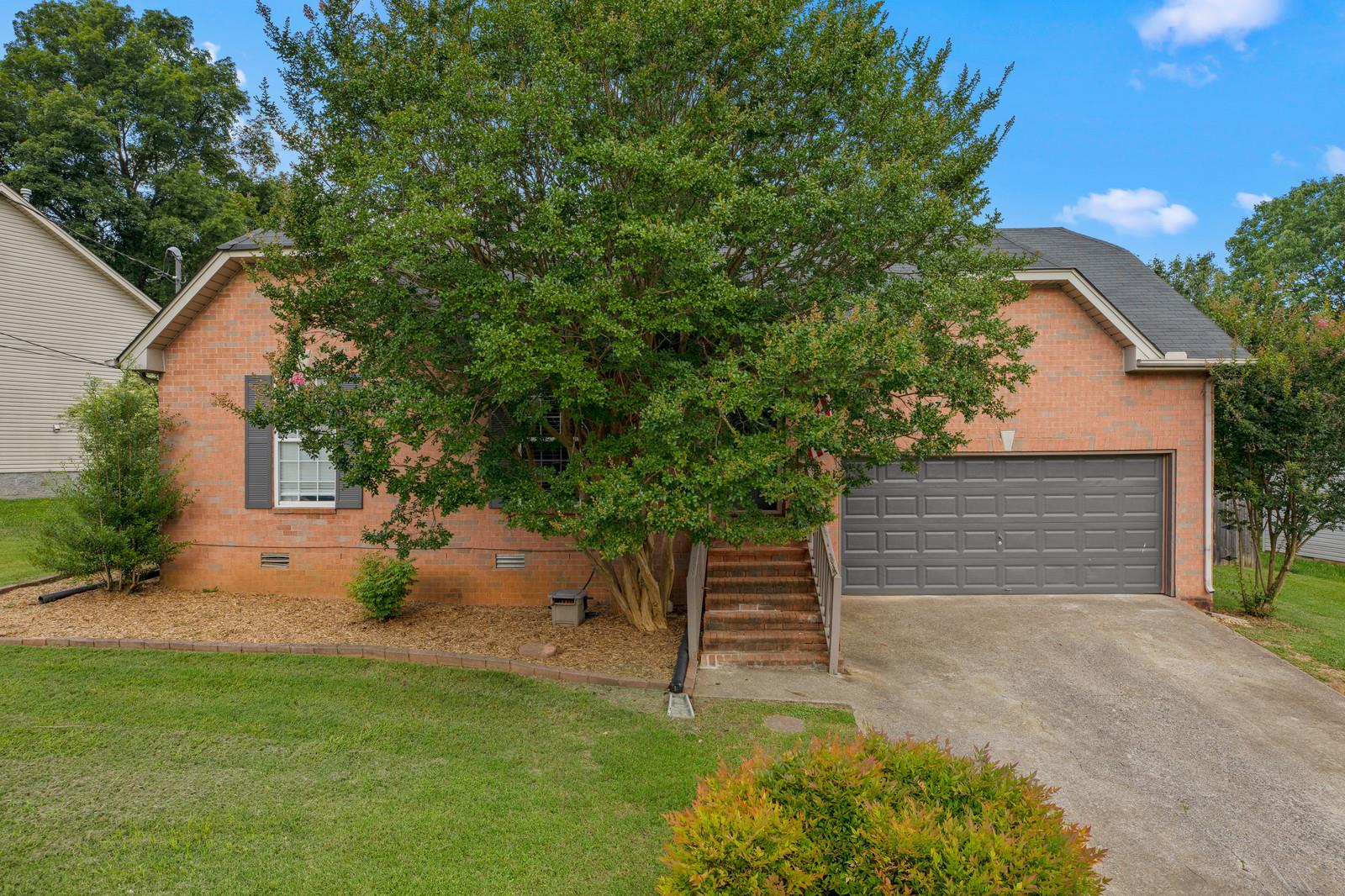 3028 Stone Bridge Road Antioch, TN 37013 - Photo 2 of 30 a view of a house with a yard and tree s