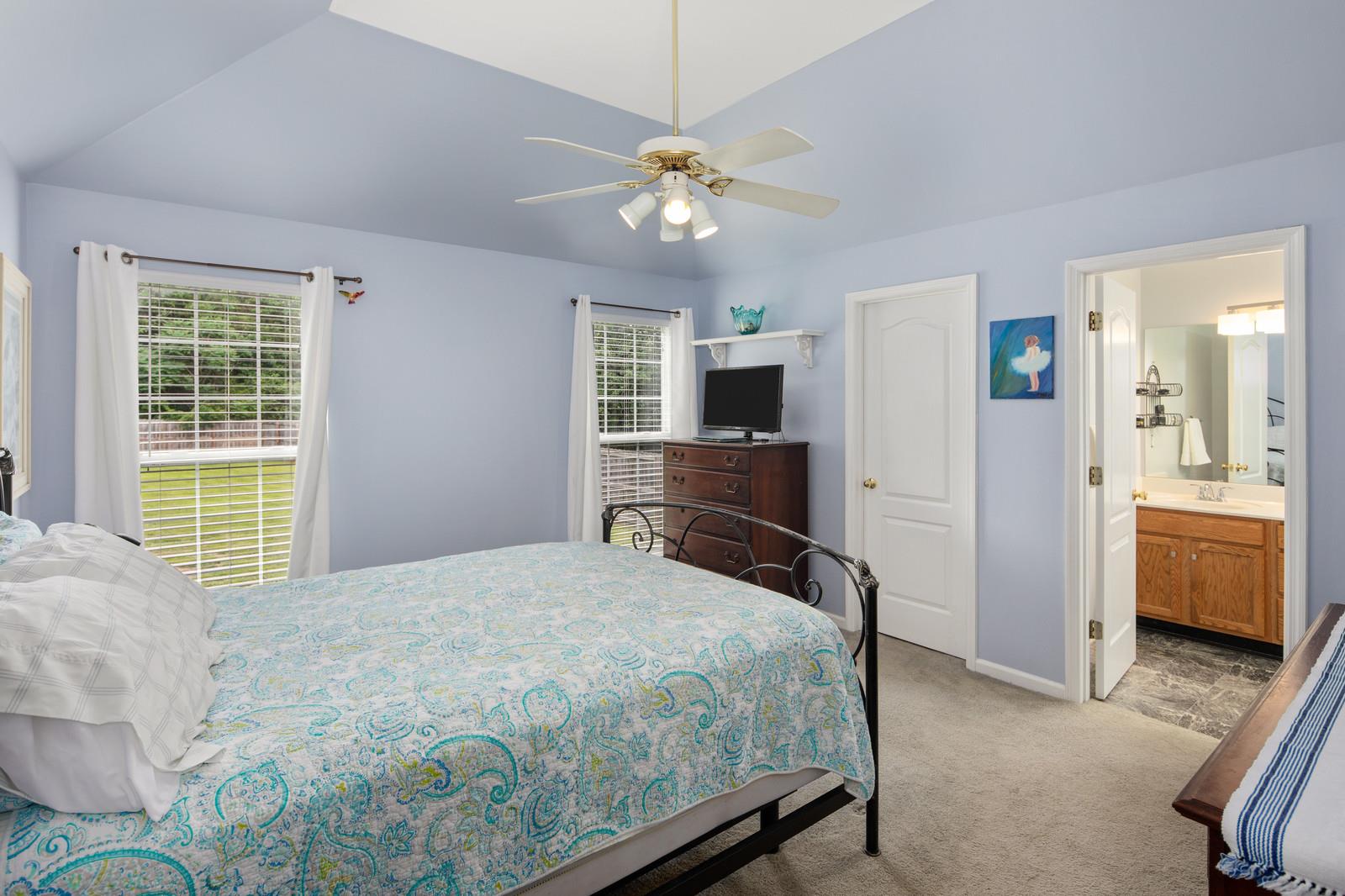 3028 Stone Bridge Road Antioch, TN 37013 - Photo 12 of 30 a bedroom with a bed and a chandelier