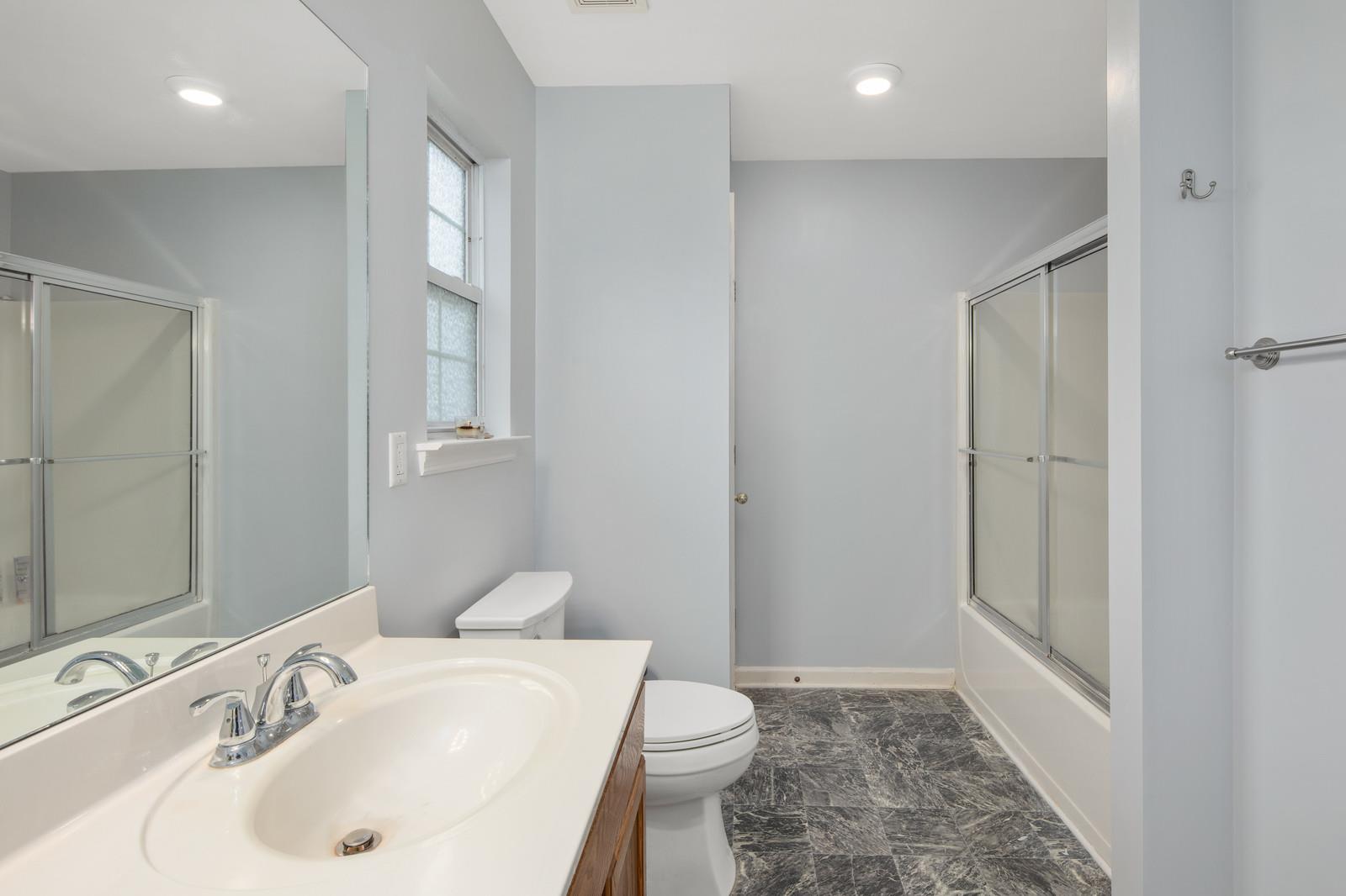 3028 Stone Bridge Road Antioch, TN 37013 - Photo 15 of 30 a bathroom with a sink toilet and shower
