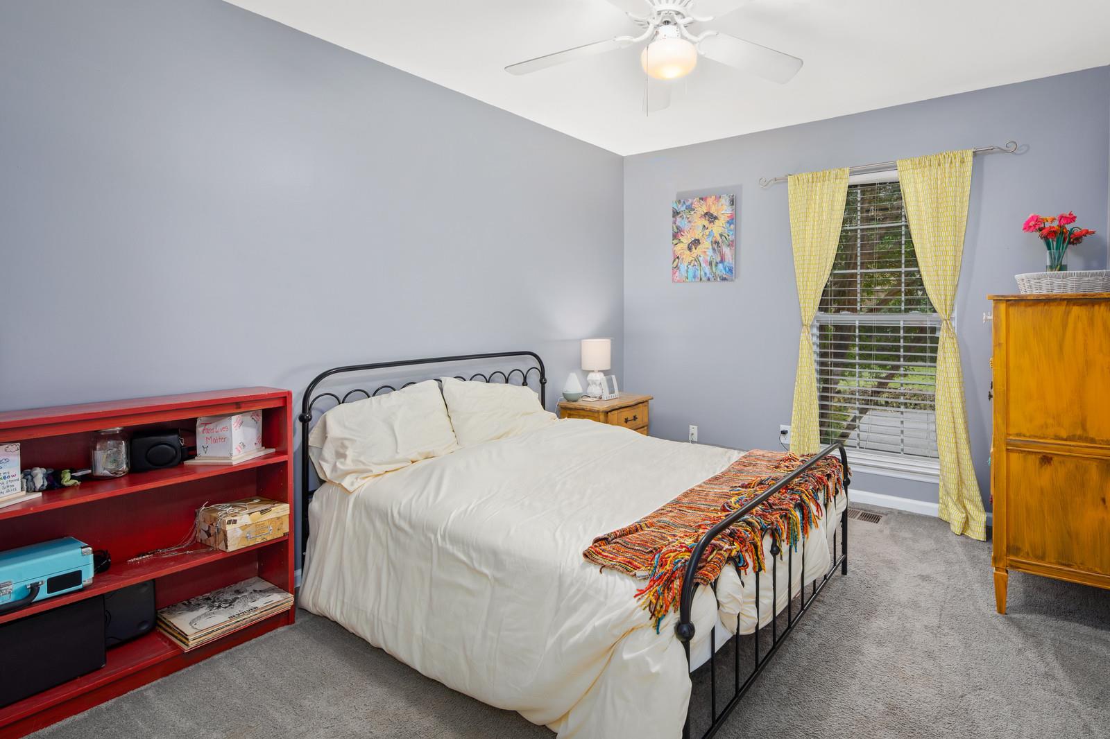 3028 Stone Bridge Road Antioch, TN 37013 - Photo 18 of 30 a bedroom with a bed and a chandelier