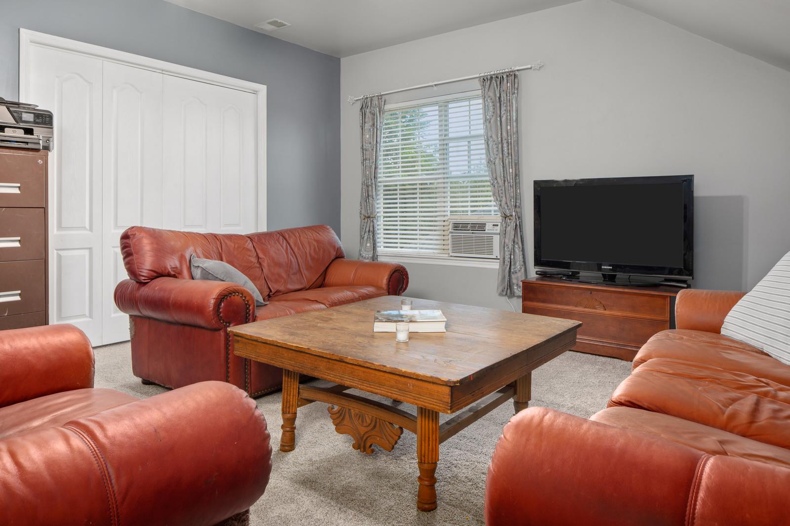 3028 Stone Bridge Road Antioch, TN 37013 - Photo 23 of 30 a living room with furniture and a flat screen tv