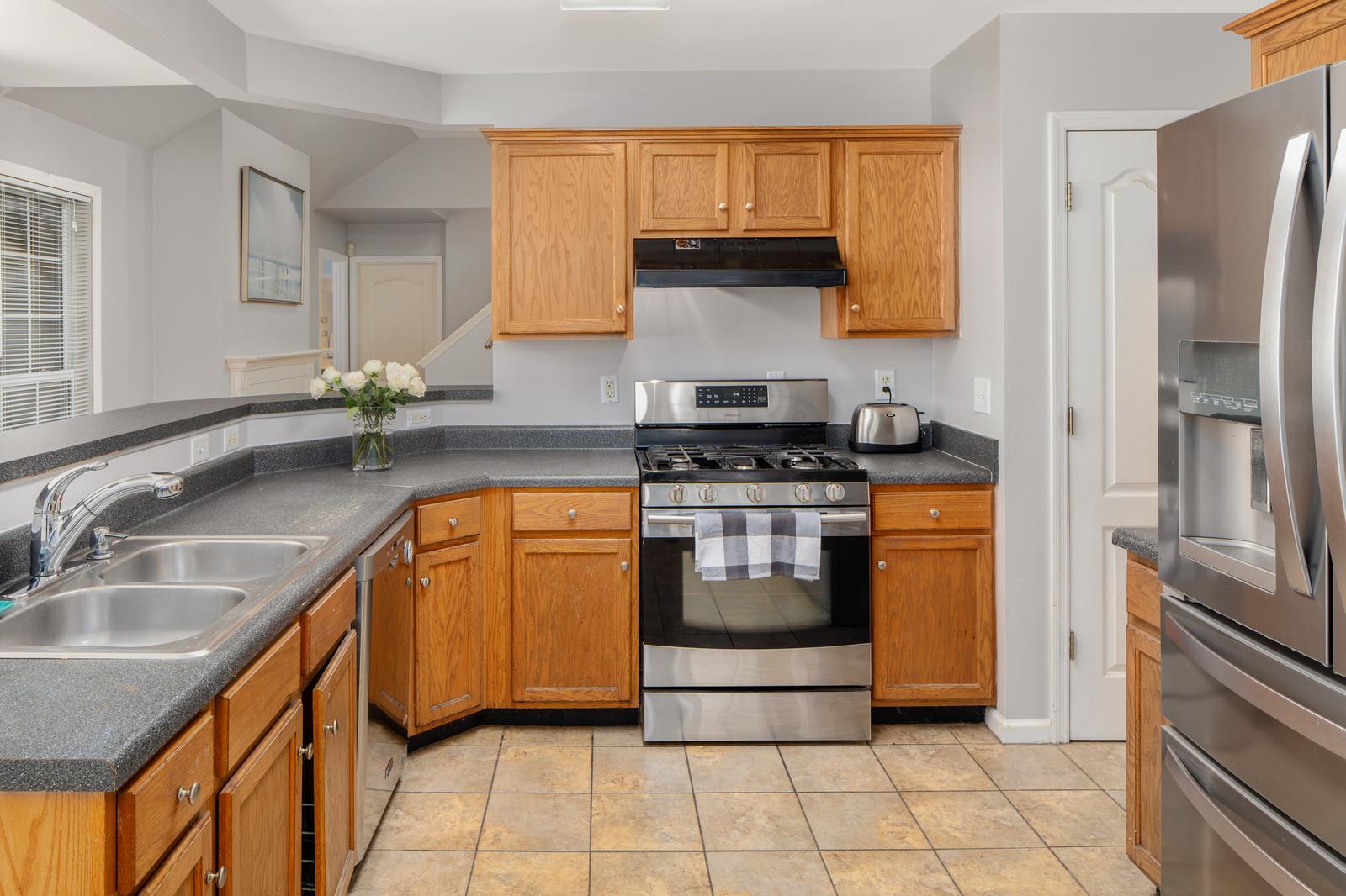 3028 Stone Bridge Road Antioch, TN 37013 - Photo 4 of 30 a kitchen with a sink appliances and cabinets