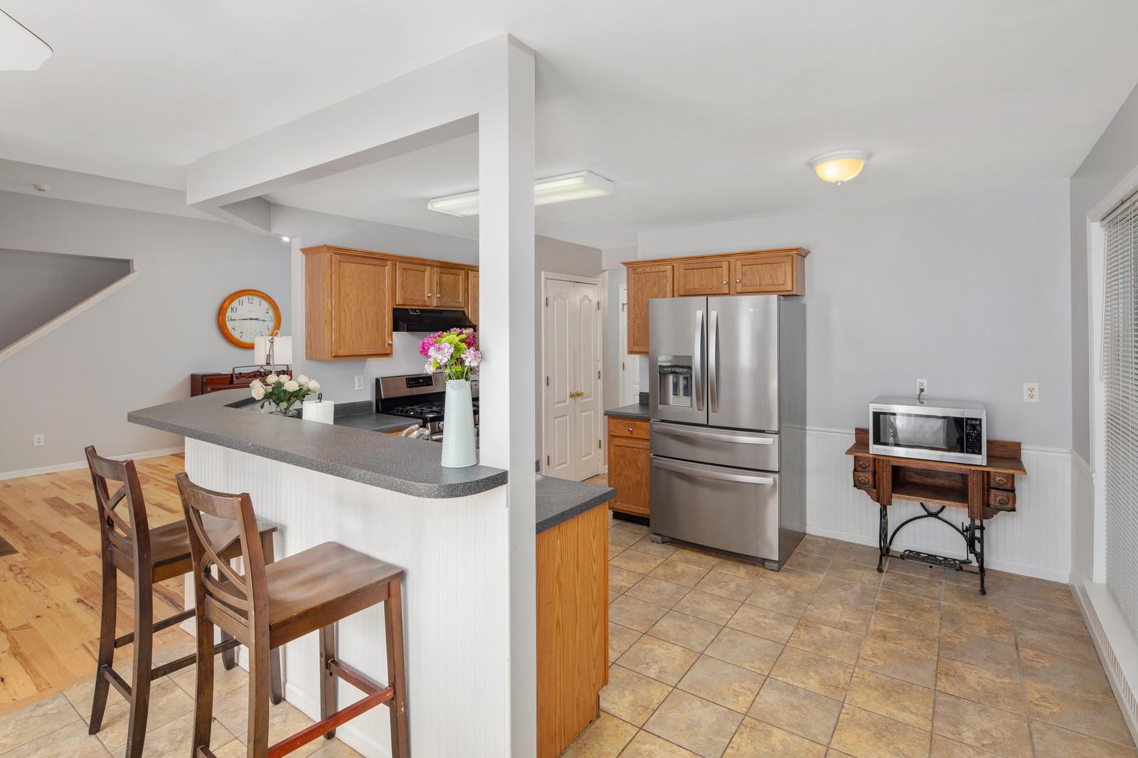 3028 Stone Bridge Road Antioch, TN 37013 - Photo 6 of 30 a kitchen with a refrigerator and a table