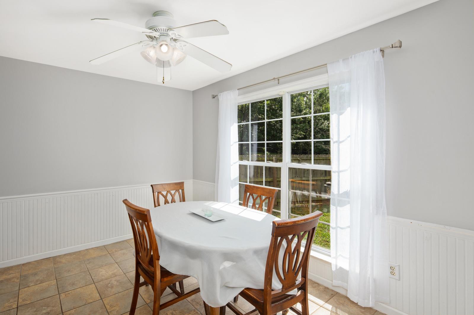 3028 Stone Bridge Road Antioch, TN 37013 - Photo 8 of 30 a view of a dining room with furniture and a window