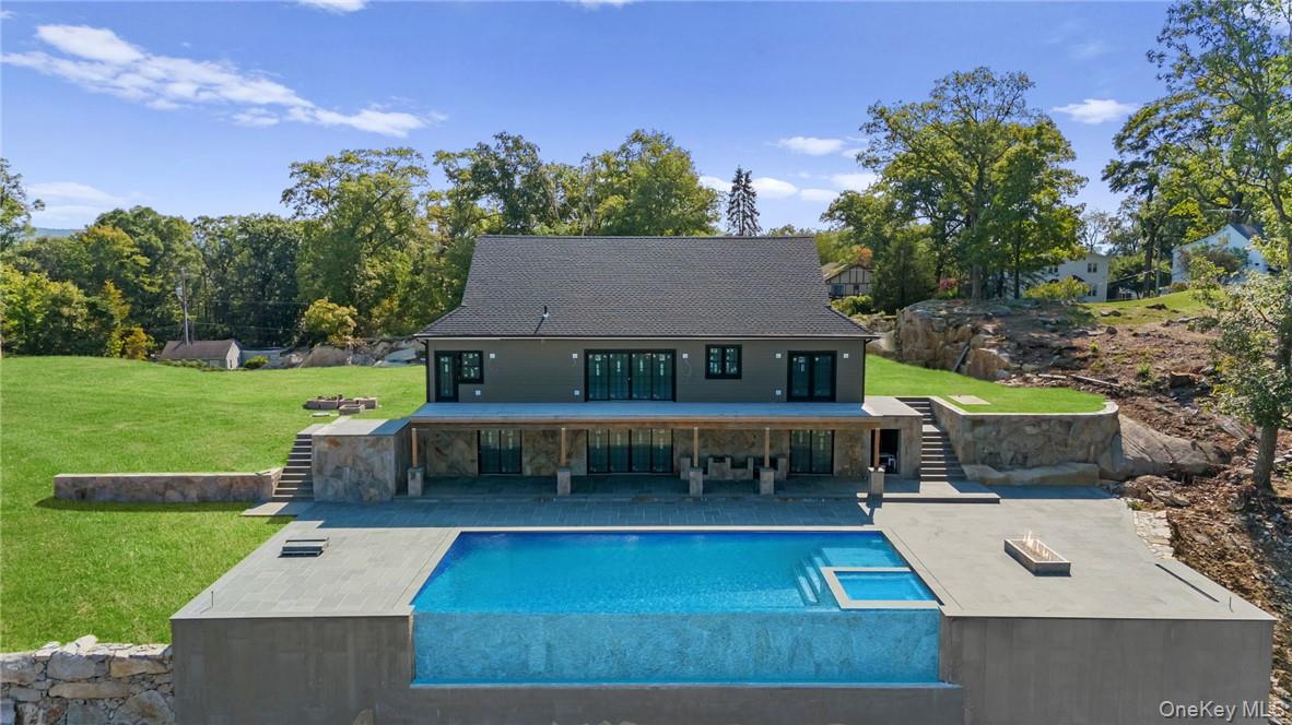 an aerial view of a house with a garden and a yard