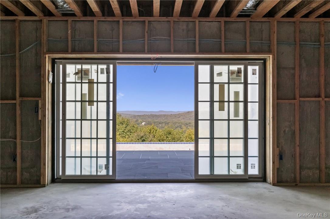 55 Ridgecrest Road Putnam Valley, NY 10537 - Photo 13 of 25 a view of an empty room with a window