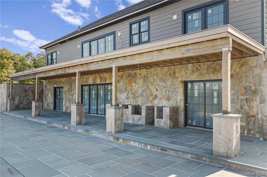 55 Ridgecrest Road Putnam Valley, NY 10537 - Photo 17 of 25 a front view of a house with a glass door