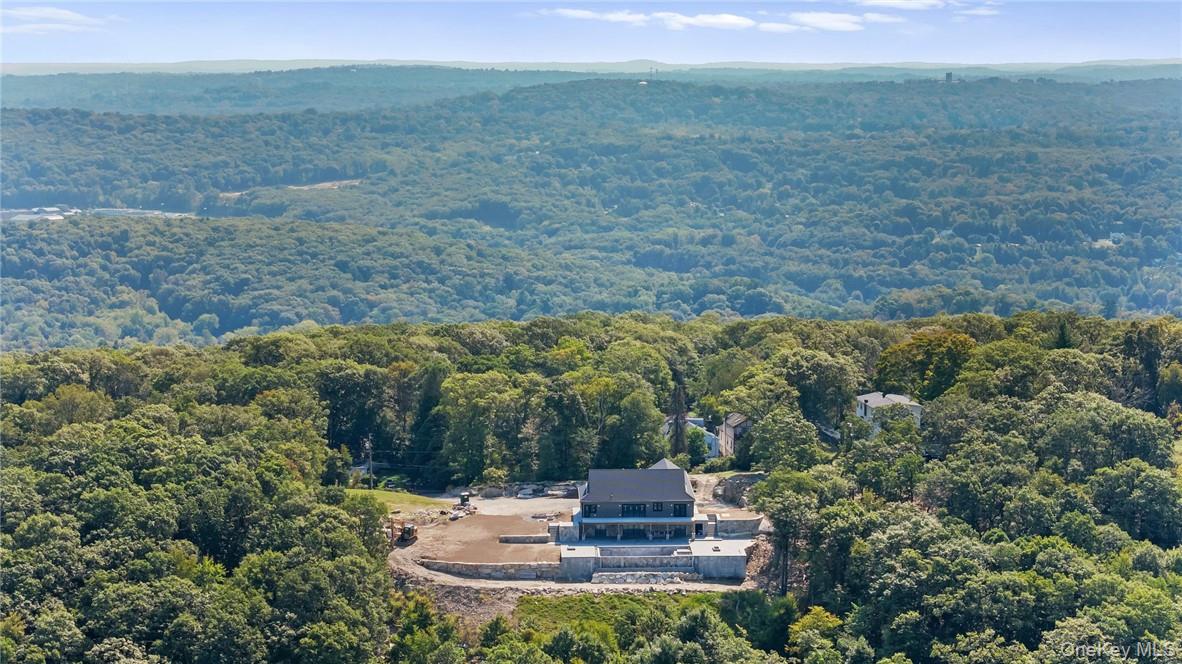 55 Ridgecrest Road Putnam Valley, NY 10537 - Photo 3 of 25 a view of a water with a yard