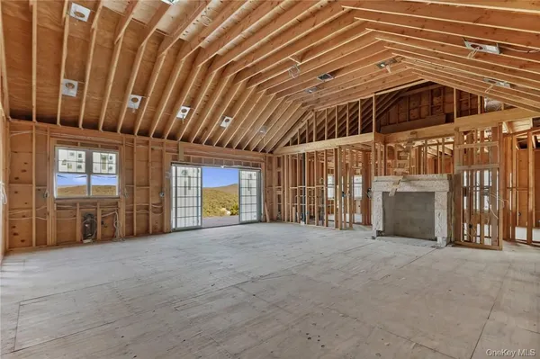 a view of an empty room with a fireplace