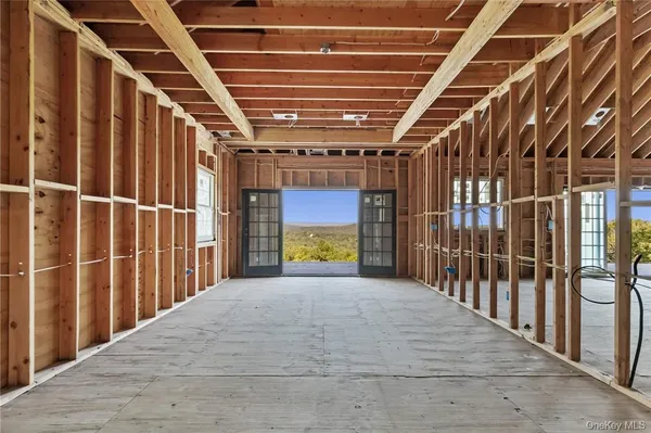 a view of porch with wooden floor