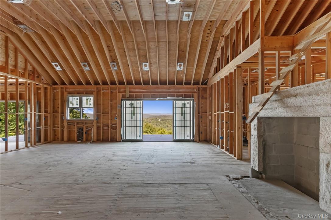55 Ridgecrest Road Putnam Valley, NY 10537 - Photo 8 of 25 a view of an front door with yellow lighting