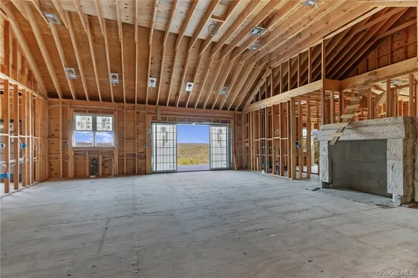 a view of an empty room with windows