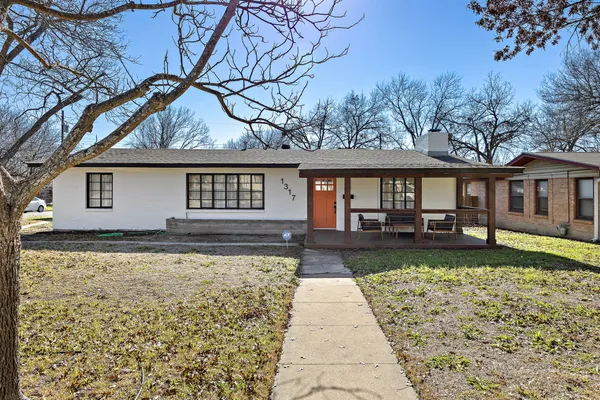 front view of a house with a yard