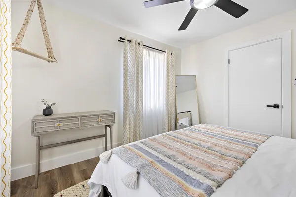 a bedroom with a bed and a dresser