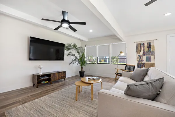 a living room with furniture and a flat screen tv