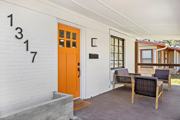 a view of livingroom with furniture and windows
