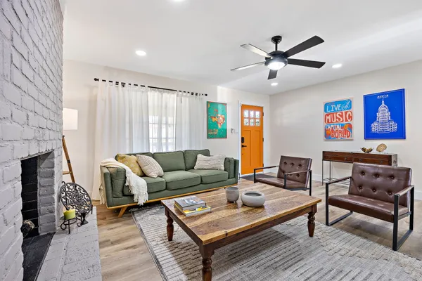 a living room with furniture and a fireplace