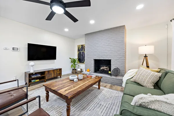 a living room with furniture and a flat screen tv