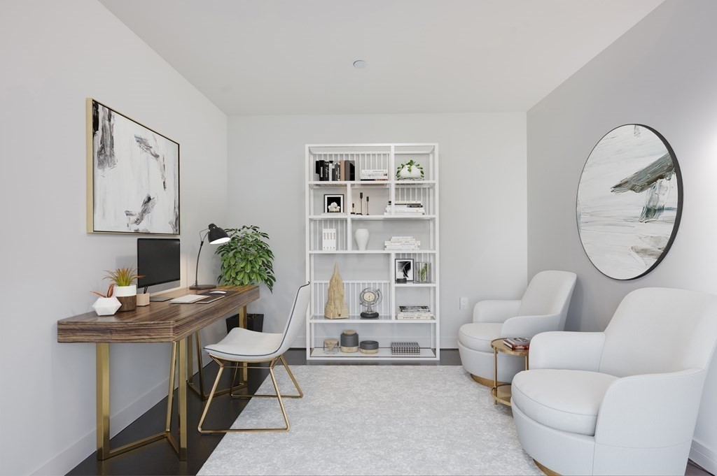 150 Seaport Boulevard, Unit 17D Boston, MA 02210 - Photo 12 of 24 a living room with furniture a rug and a potted plant